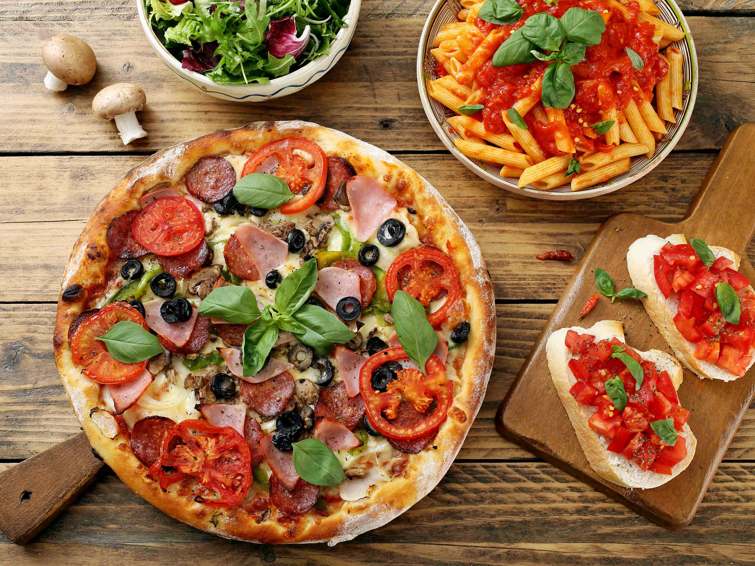 Top,View,Pizza,Pasta,With,Tomato,Sauce,And,Salad,Bowl